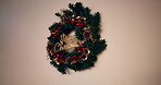 Christmas, wreath or holiday decoration in home for celebration, festive aesthetic or party trinket. Creative, mockup space and evergreen ornament in apartment for welcome, tradition and xmas event