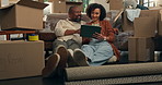 Moving in, couple and ideas with tablet in new house for home renovation, digital layout or mortgage. Interior design, app and property investment with boxes, man and woman for real estate purchase