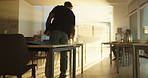 Walking, college student and man in class for education, learning or study with low angle. Person, university and back view with laptop for scholarship, arrival or morning lesson with sunlight flare