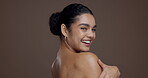 Shoulder, skincare and laughing with face of woman in studio for beauty, body care and hydration. Aesthetic, dermatology and natural glow with female model on brown background space for collagen