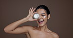 Girl, face and skincare cream in studio with smile, cover eye and playful laugh for beauty by background. Woman, model and space for product, results or moisturizer lotion for dermatology in Mexico