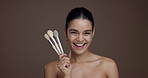 Girl, makeup brush and face with laugh in studio, results and transformation with beauty by background. Woman, model and space for cosmetics, foundation or portrait for pride, skin and happy in Peru