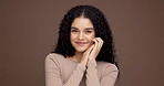 Happy model, face and confidence with smile in studio for makeup on a brown background. Portrait, female person or woman with self care, satisfaction or cosmetics or treatment results on mockup space