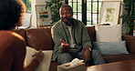 Talking, psychology and writing with man on sofa for therapy session, tracking progress and chat. Mental health, counseling and patient advice with people in therapist clinic for help and healing