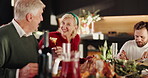Christmas dinner, conversation and family in home for love, bonding and laughing. Senior parents, woman and man eating food, talking and happy people share meal for xmas holiday at party together