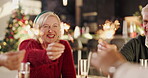 Sparklers, smile and family in home for christmas celebration, event or gathering together. Happy, holiday and people with handheld fireworks for xmas party, dinner or festive season at house.
