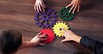 Gear, teamwork and community with hands of business people for synergy, mission and support. Partnership, puzzle and problem solving with above of employees in office for solidarity and cogwheel