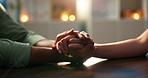 Couple, love and holding hands on table for care, support and commitment with bokeh on date. Man, woman and comfort with trust for bonding together, respect or connection for marriage in restaurant
