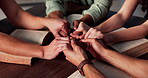 Praying, holding hands and people with bible, church and Christian with faith in God or holy spirit. Prayer group, together and worship with scripture in chapel, table or belief for religion or Jesus