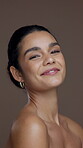 Face, natural beauty and woman in studio for wellness, glow or clear skin on brown background. Results, satisfaction and female person with dermatology or skincare, shine and cosmetic care portrait