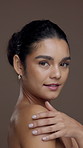 Body care, beauty and face of girl in studio with glowing skin, hydration and exfoliation treatment. Clean, woman and smile with skincare on brown background for regeneration or chemical peel results