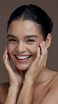 Touch, beauty and face of woman in studio for skincare results, cosmetics and facial treatment. Salon, dermatology and portrait of person smile for natural glow, shine or wellness on brown background