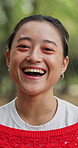 Adventure, face and laughing with Asian woman outdoor in nature for break, comedy or journey. Funny, happy and travel with Japanese person in forest or woods for holiday, tourism and vacation