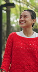 Walking, animal and woman with leash, outdoor and smile for fresh air, morning and bonding with pet. Happy, Japanese person and travel with domestic companion in nature, together and active on trip