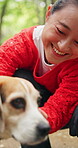Smile, relax and dog with woman in park for bonding, pet training and foster care. Animal adoption, happiness and love with person and beagle in nature for petting, summer holiday and canine friend