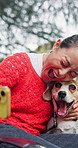 Smile, selfie and dog with woman in park for bonding, pet training and social media. Online memory, happiness and picture with person and beagle in nature for relax, summer holiday and canine friend