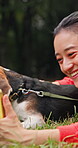 Phone, woman and video call with dog at park for communication, wave and talking. Person, pet and mobile for virtual chat with greeting, happiness and relax together with beagle on grass in Japan