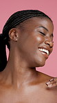 Body care, happy and face of black woman in studio with beauty, natural or smooth skin for glow. Portrait, hydration and African female person with dermatology or cosmetics routine by pink background