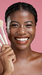 Face, laugh and black woman with makeup brush in studio for foundation, powder and glow. Self care, cosmetics tools and skincare with happy model with facial product for beauty on pink background
