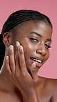 Happy, face and woman with oil for skincare, self care and anti aging with cosmetics or moisturizer. Studio background, black person and facial treatment for healthy skin, wellness or hyaluronic acid