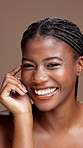 Happy black woman, face and skincare in studio for beauty, dermatology and facial hydration. Portrait, soft skin and African model with glow, wellness and laughing with self care on brown background