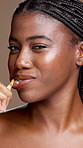 Dental care, face and black woman brushing teeth studio background for hygiene, grooming or wellness. Oral health, toothbrush and portrait of African female person cleaning mouth in morning routine.