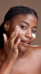 Face, black woman and eye patches for skincare, results or remove dark circles. Portrait, cosmetics and model with gel pads for beauty, detox or happy with facial treatment on brown studio background