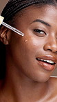 Face, black woman and apply oil for skincare, hyaluronic acid or vitamin c. Portrait, cosmetics and happy model with dropper for serum, anti aging and hydration for health on brown studio background