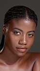 Face, confident or black woman with body care for skin hydration, wellness or shine. Portrait, studio or African female person isolated dark background with smooth texture, beauty cosmetics or glow