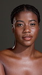 Face, glow or black woman with body care for skin hydration, wellness or shine. Portrait, studio or African female person isolated dark background with smooth texture, beauty or hygiene cosmetics 