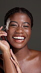Beauty, smile and hand with face of black woman in studio for skincare, shine and dermatology. Glow, collagen and hydration with female person on dark background for self care and clear skin