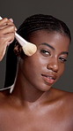 Brush, makeup and face of black woman in studio with beauty, confidence and facial routine. Glow, foundation and portrait of African person with cosmetic tool for cosmetology by gray background.