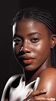 Cosmetic, face and woman with glow, skincare or wellness of smooth skin, studio or facial treatment. Black background, African person and self care for beauty, shadow and shine with dermatology