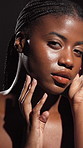 Black woman, beauty and makeup in studio with glow for cosmetics on a dark background. Portrait, female person or African model with shine for skincare treatment, cosmetology or facial transformation