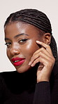 Black woman, face and cosmetics in studio for beauty, style confidence and aesthetic. Female person, makeup and red lipstick on white background with eyelash extension, hair braids and touch skin