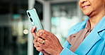 Mature woman, hands and typing with phone for social media, business chat or discussion in office. Closeup, female person or employee with mobile smartphone for app, research or network in workplace