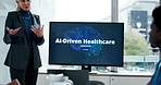 Hospital, presentation and woman with monitor, talking or explaining ai driven healthcare or screen. Clinic, people and administrator with info for new tech, discussion and plan for automated systems