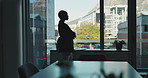 Business, thinking and woman with arms crossed, silhouette  and confidence in office, accounting and view. Person, financial agency and employee in workplace, decision and problem solving with window