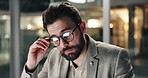 Business man, tired and glasses with eye strain in office for auditing deadline, burnout or stress. Night, auditor or overwhelmed with pressure for risk management, balance sheet review or overworked