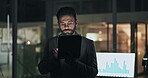 Man, typing and tablet in office at night for accounting, finance planning and budget report. Male person, digital and graphs of financial comparison, audit feedback and agenda on investment deadline