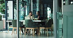 Business, collaboration and colleagues with laptop, discussion or planning for ad campaign or online. Talking, man and woman with tablet for marketing strategy, teamwork or people with tech in office