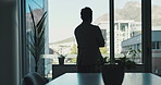 Business, thinking and man with window, silhouette  and confidence in office, accounting and decision. Person, financial agency and employee in workplace, opportunity and problem solving with view