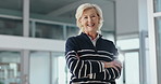 Crossed arms, business and face of mature woman in office with confidence, finance manager and pride. Corporate, professional and portrait of person in lobby for financial company, ambition and smile