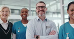 Face, confident and medical team with arms crossed, clinic or happy for healthcare services or help. Nurse, people and together with commitment in hospital, pride and colleagues with smile and unity