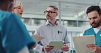 Hospital, doctor and colleagues with tablet, discussion and medical report on website and documents. Talk, manager and people with paperwork for diagnosis, collaboration and ideas for healthcare
