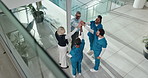 People, high five and team of doctors at hospital, circle or above with solidarity for medical career. Group, nurses or surgeon with support for goals, celebration or motivation at healthcare clinic