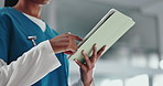 Hands, nurse and tablet in hospital for medical schedule, information or review healthcare history. Technology, woman and worker in clinic to scroll email, update report and research on internet