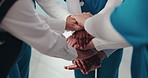 Hands stack, doctors and group at hospital in circle with motivation for healthcare services in corridor. People, nurse and surgeon in team huddle with celebration, collaboration and goals at clinic