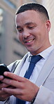 City, phone and smile with lawyer man outdoor for communication, feedback or update on court case. App, legal and text message with happy attorney in urban town for trial litigation on mobile