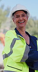 Arms crossed, face and funny with construction worker woman outdoor for development or engineering. Architecture, building and laughing with happy developer on industrial site for project management